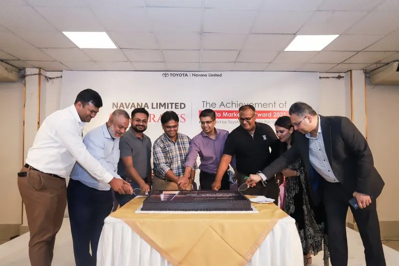 Navana Limited team cutting a cake to celebrate the Toyota Marketing Award 2021