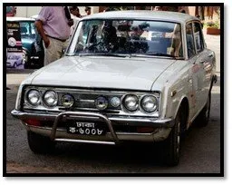 A Toyota Corona on a Dhaka registration plate
